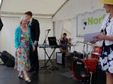 Linda goes to receive the Community Champions Award